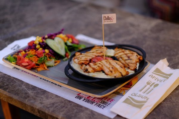 Grilled Peach Prosciutto Salad served on a platter
